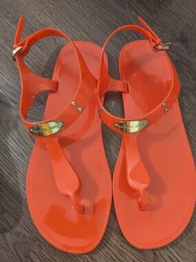 Michael Kors Orange Jelly T-Strap Sandals with Gold Logo Plaque